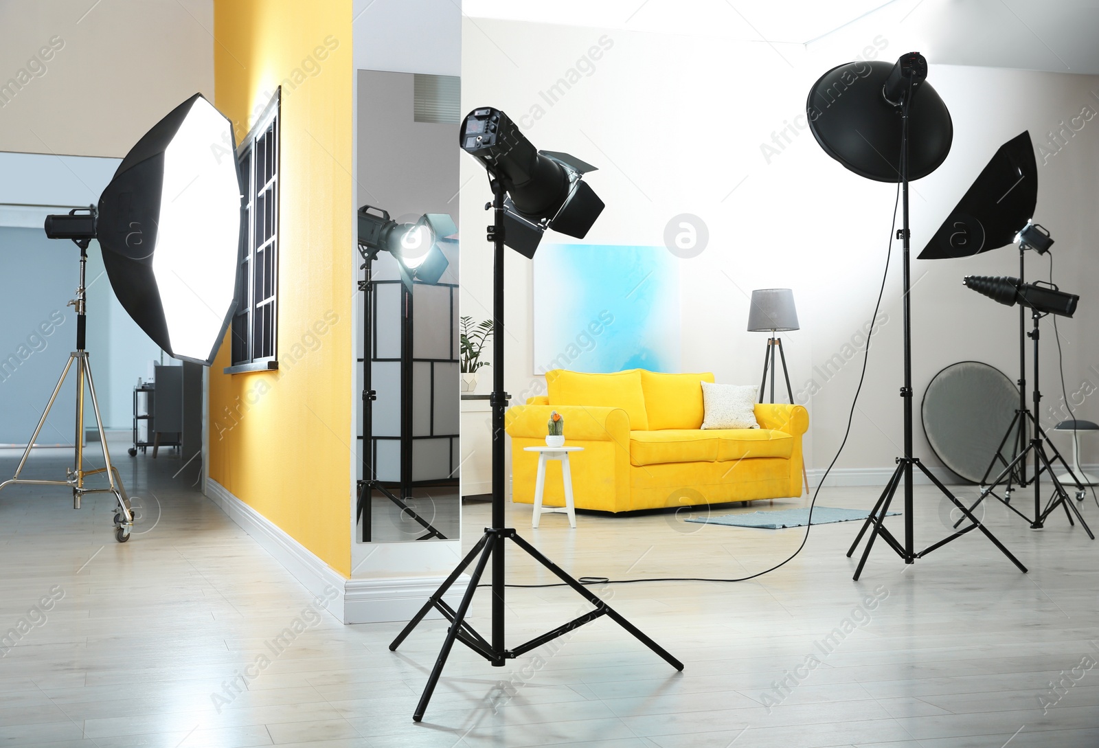 Photo of Example of living room interior design and professional equipment in photo studio