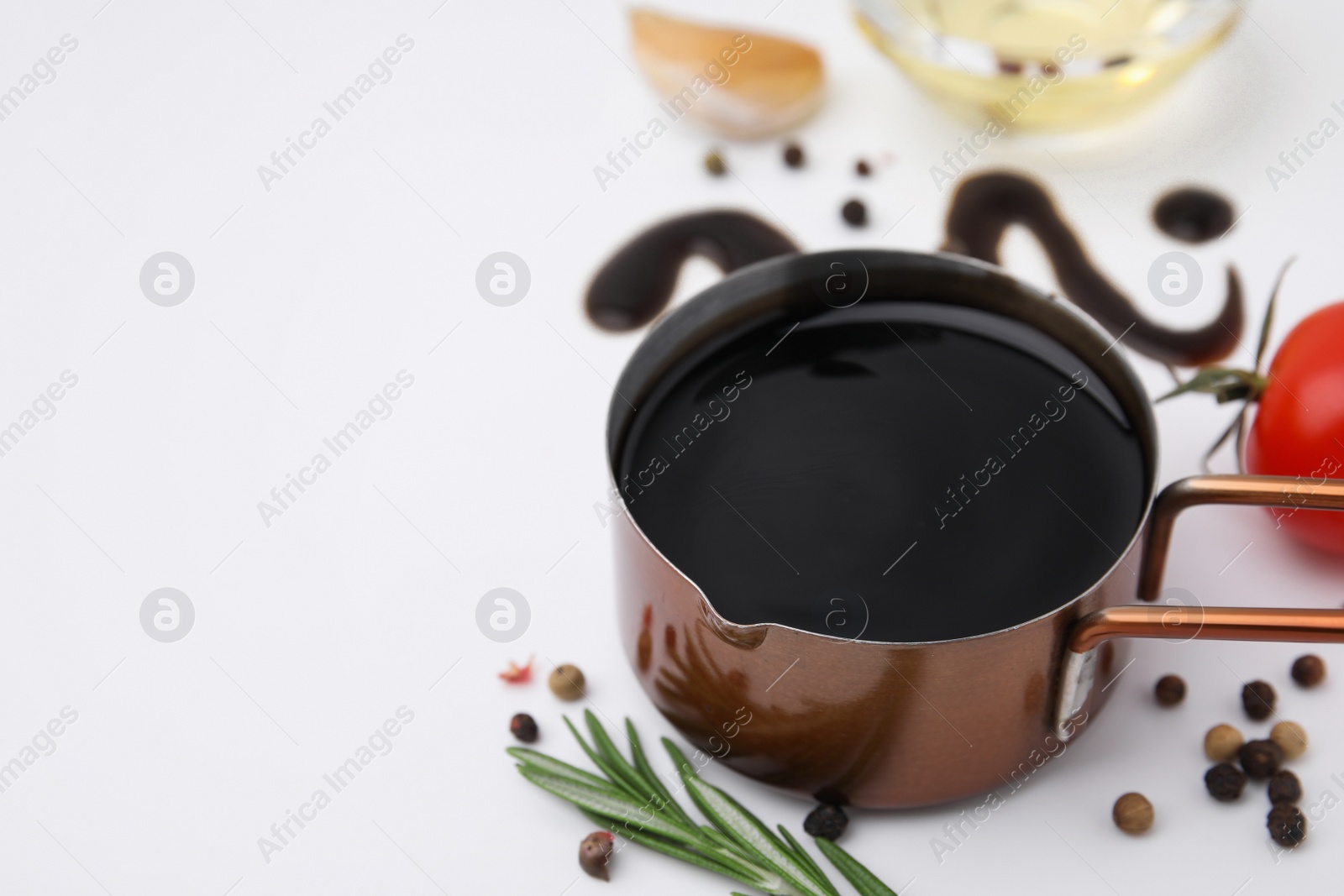 Photo of Organic balsamic vinegar and cooking ingredients on white background. Space for text