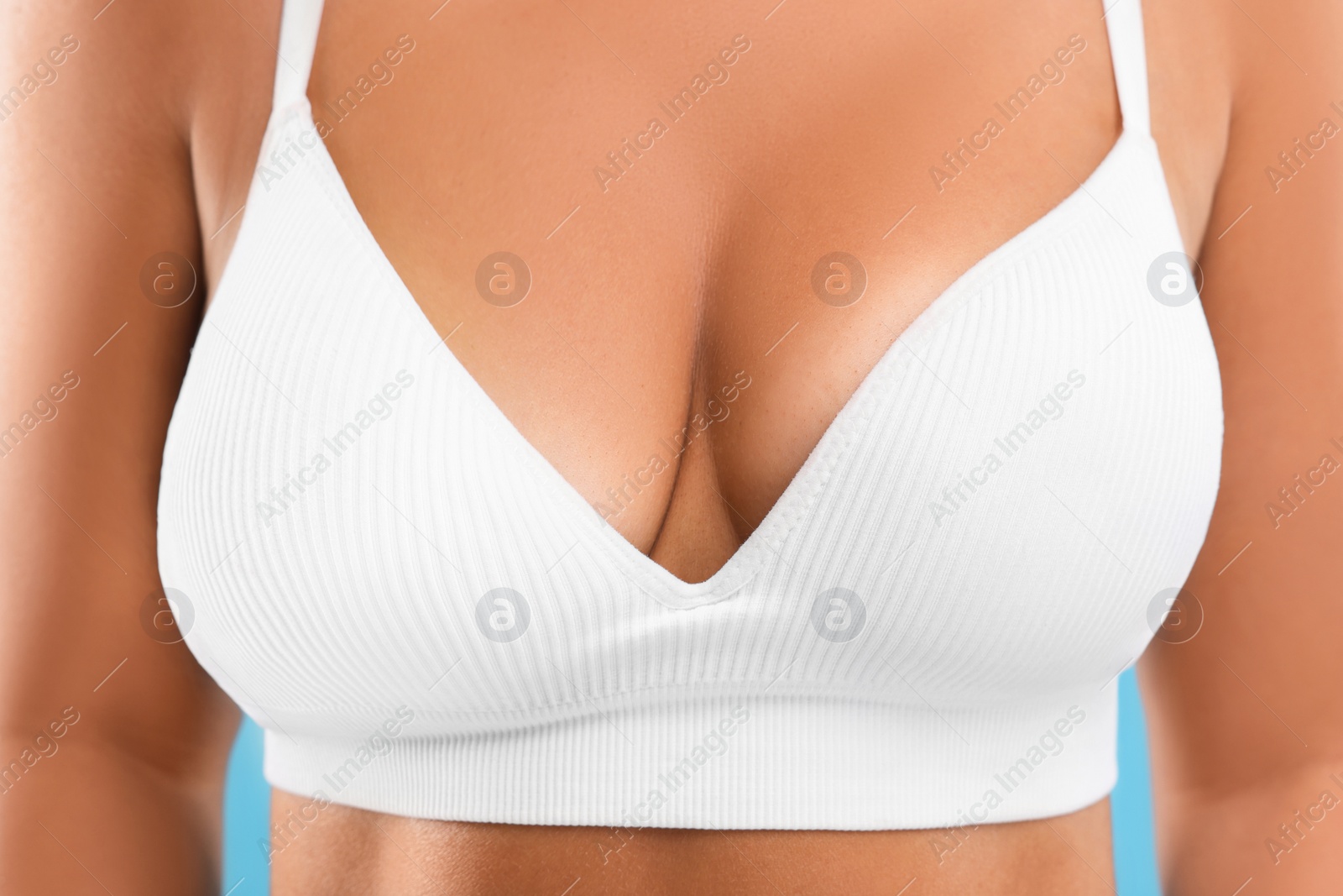 Image of Woman with breast asymmetry in top, closeup