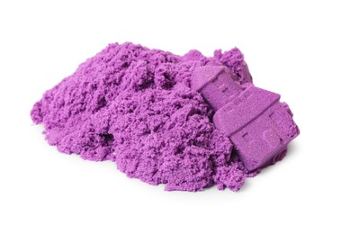Photo of Castle tower made of purple kinetic sand isolated on white