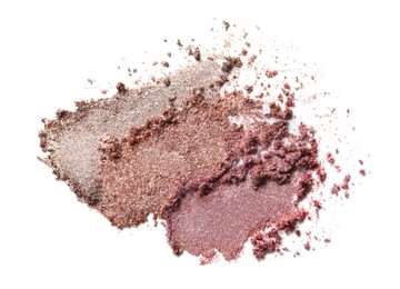 Crushed eye shadows on white background, top view. Professional makeup product