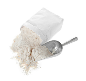 Photo of Overturned paper bag and scoop with flour isolated on white