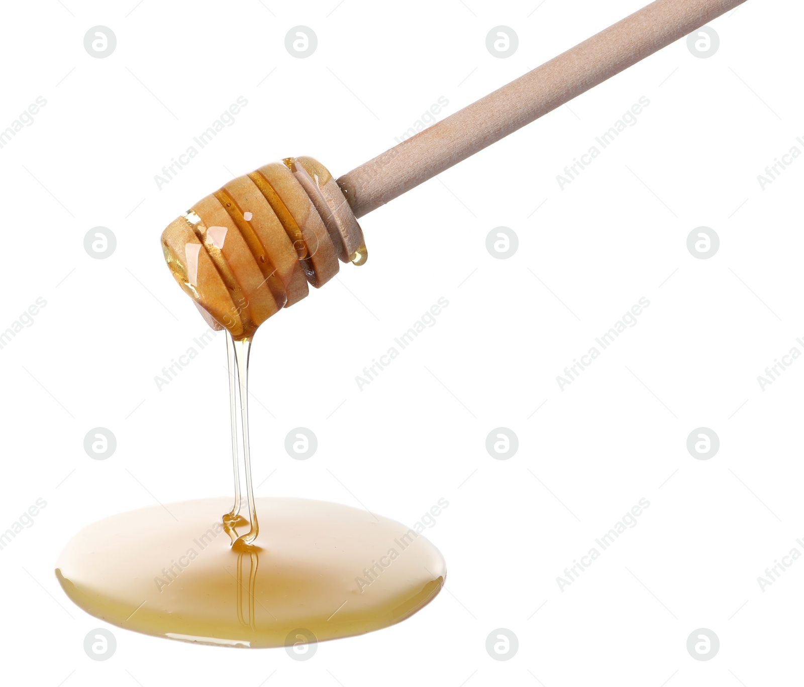 Photo of Fresh honey dripping from dipper on white background