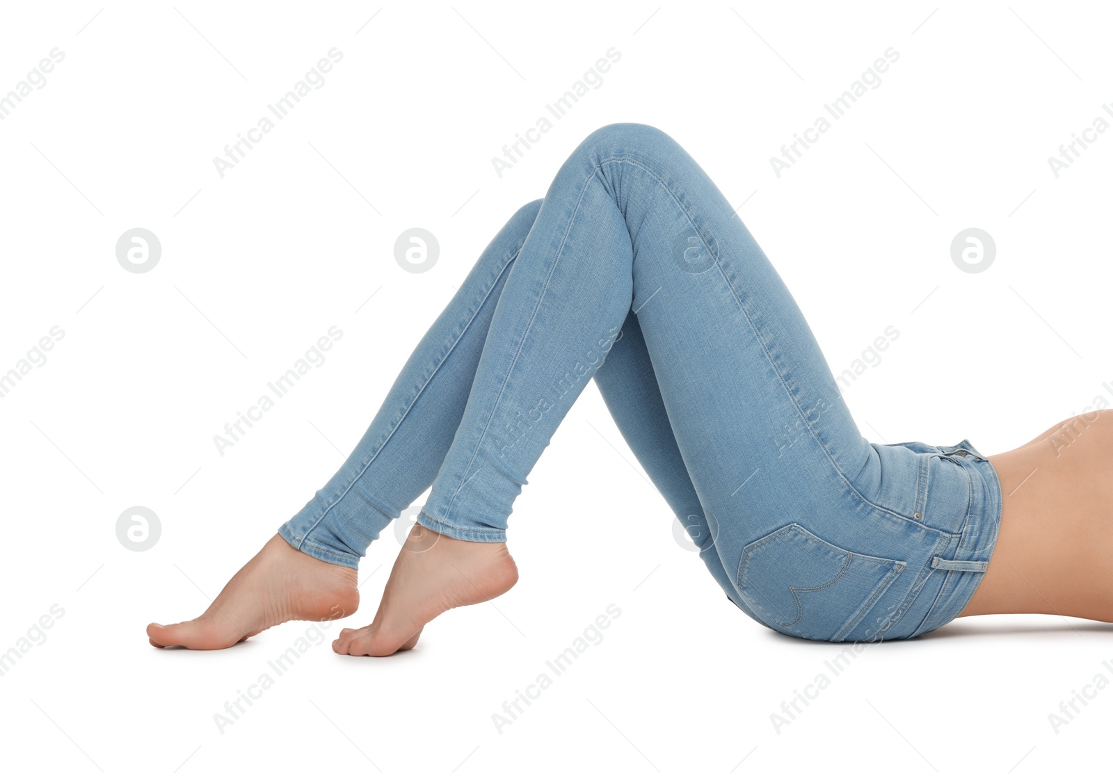 Photo of Woman wearing stylish light blue jeans on white background, closeup