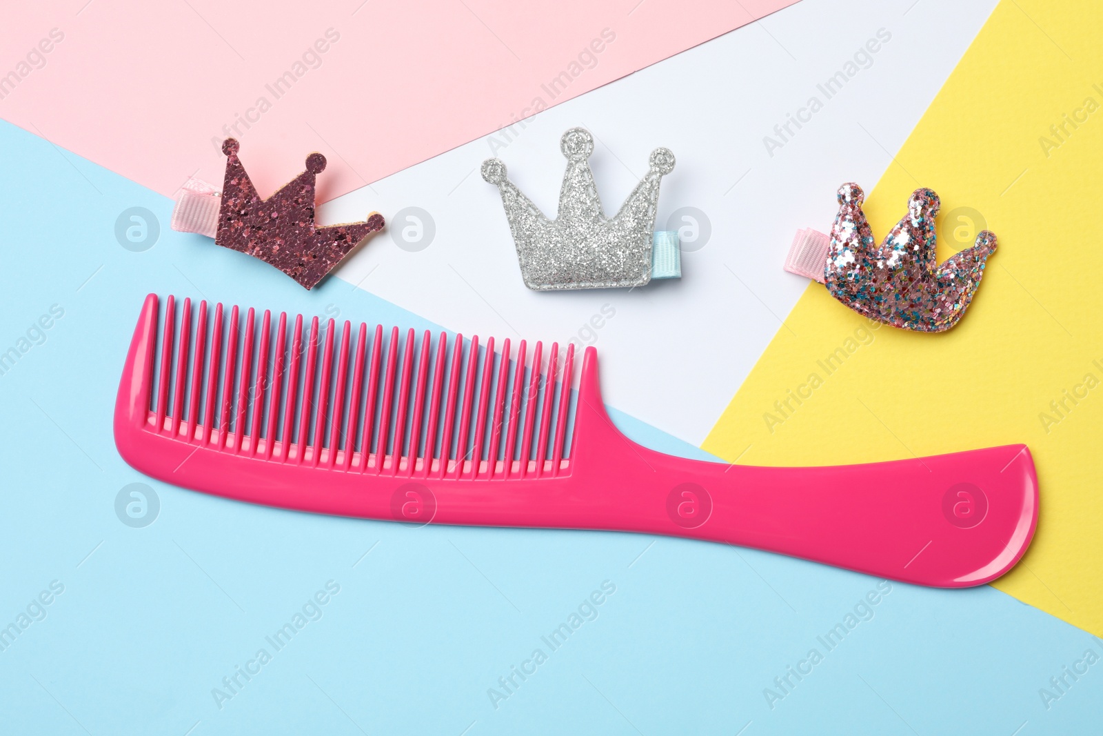 Photo of Flat lay composition with modern hair comb on color background