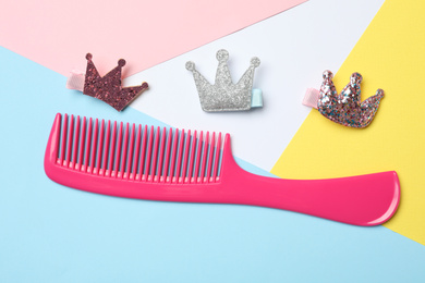 Flat lay composition with modern hair comb on color background