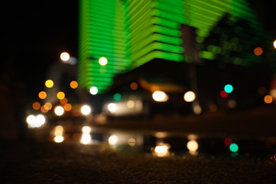 Photo of Blurred view of cityscape with bokeh effect. Night life