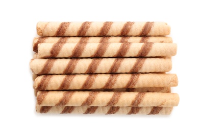 Tasty wafer roll sticks on white background, top view. Crispy food