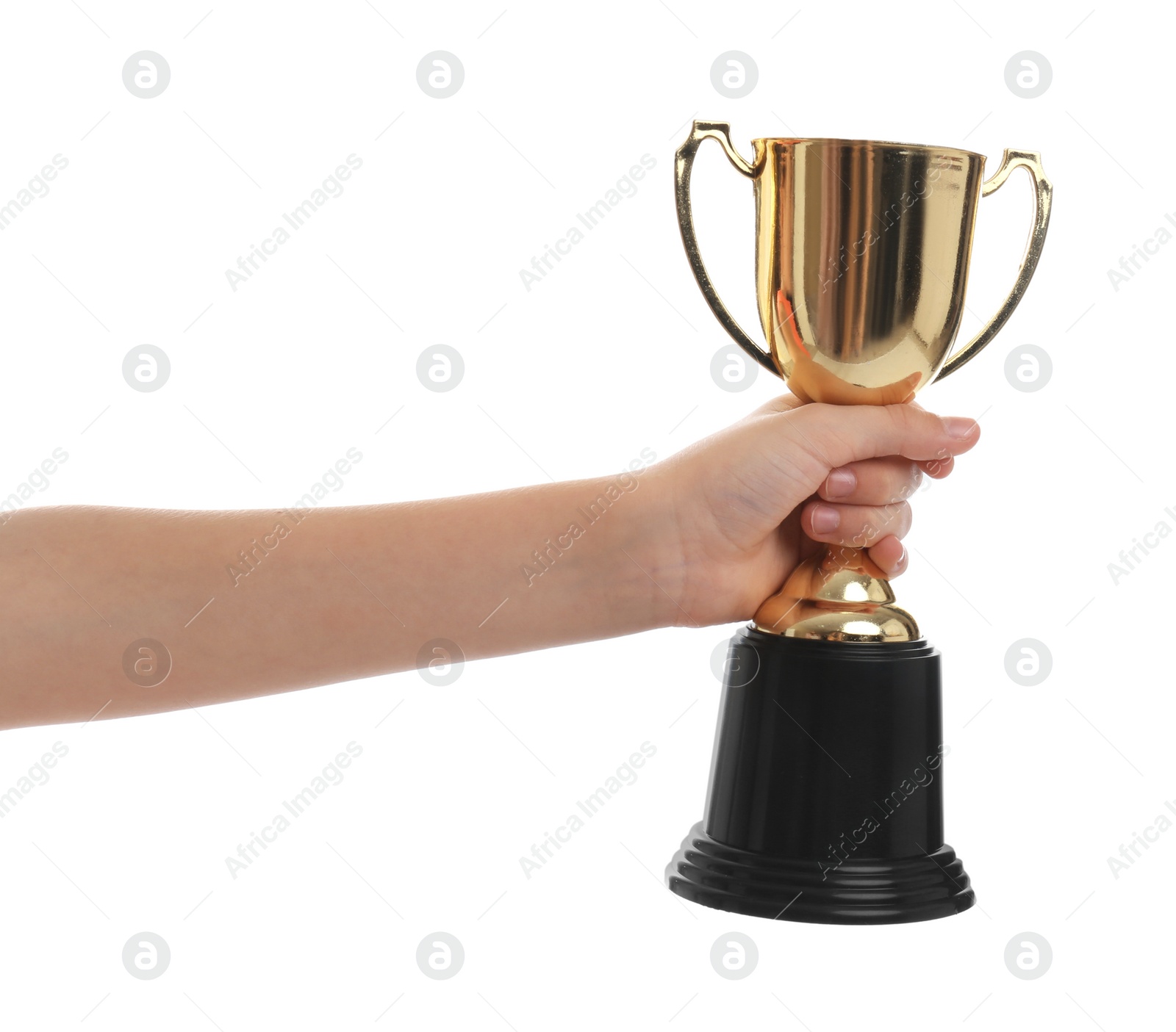 Photo of Child holding golden winning cup isolated on white, closeup