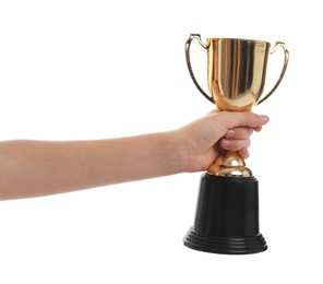 Photo of Child holding golden winning cup isolated on white, closeup