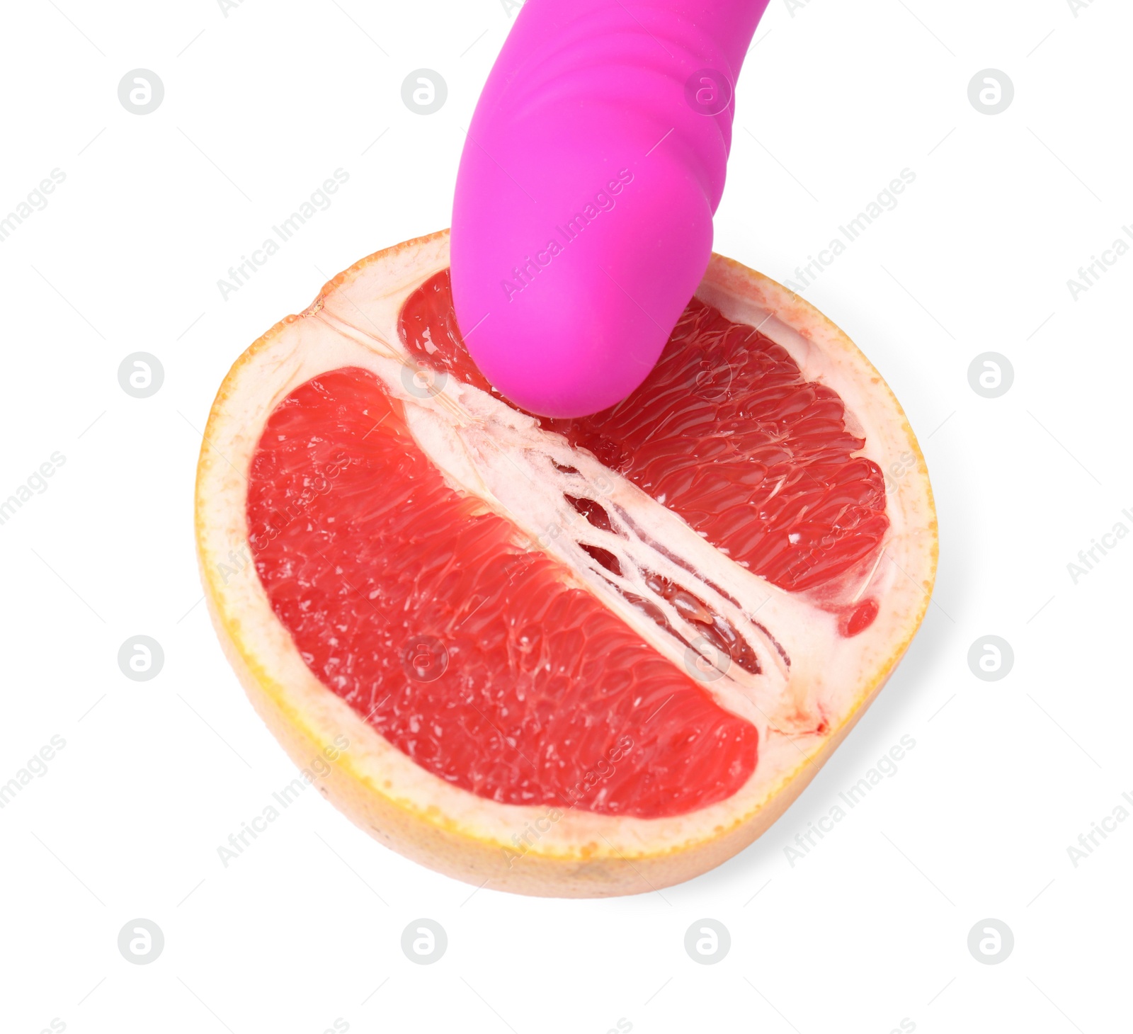 Photo of Half of grapefruit and purple vibrator on white background. Sex concept