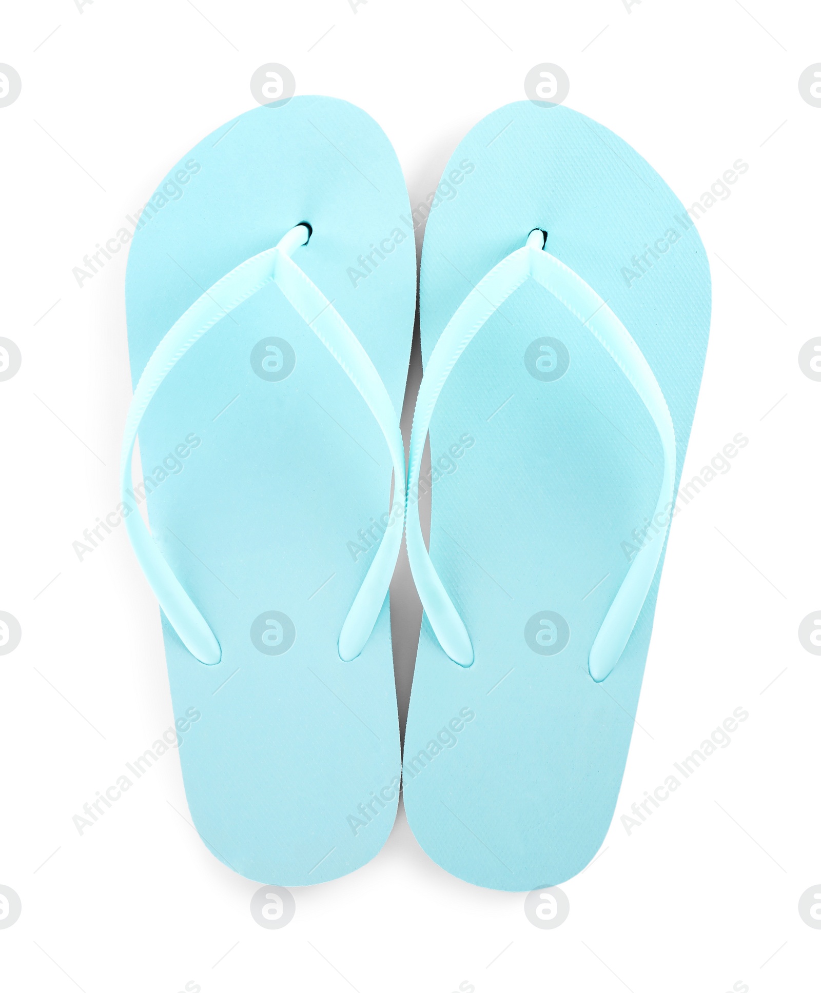 Photo of Light blue flip flops isolated on white, top view. Beach accessory