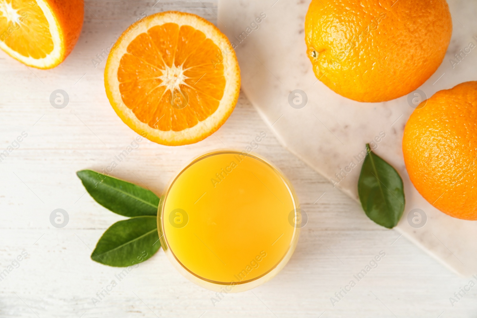 Photo of Flat lay composition with orange juice and fresh fruit on wooden background