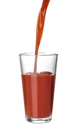 Pouring fresh juice into glass on white background