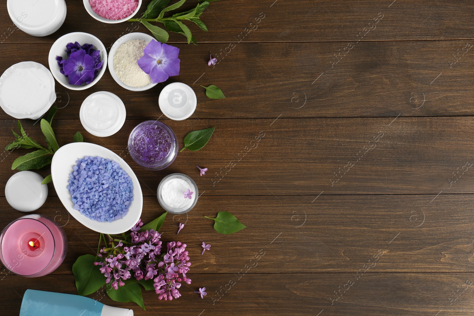 Photo of Flat lay composition with homemade cosmetic products and fresh ingredients on wooden table. Space for text