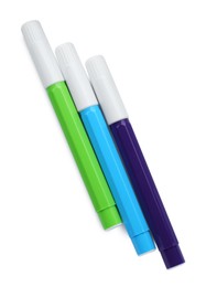 Different colorful markers on white background, top view