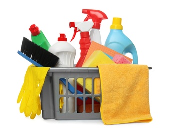 Photo of Basket with different cleaning products and tools on white background