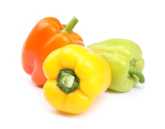 Fresh ripe bell peppers on white background