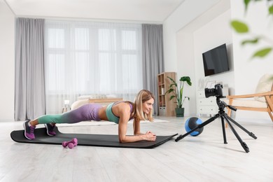 Fitness trainer recording online classes at home