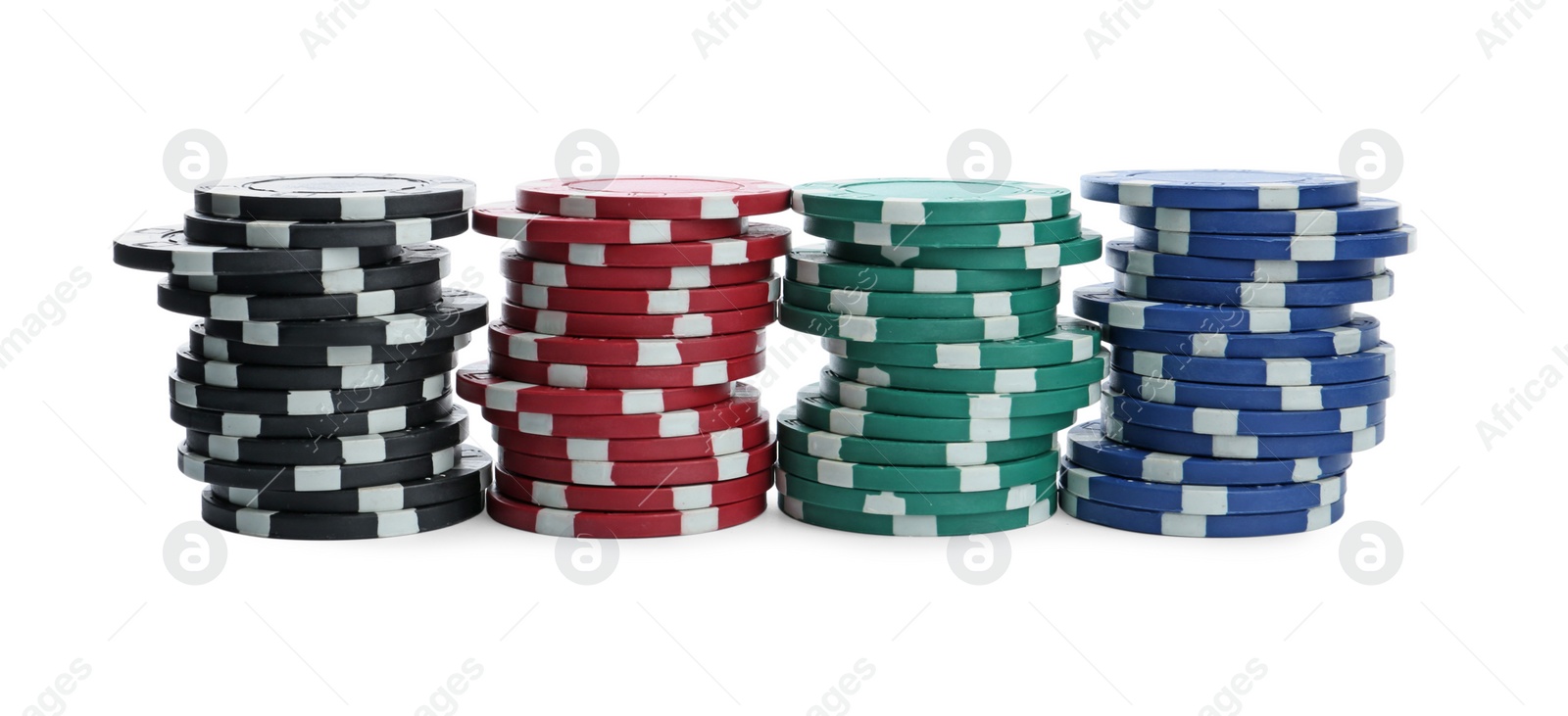 Photo of Plastic casino chips stacked on white background. Poker game