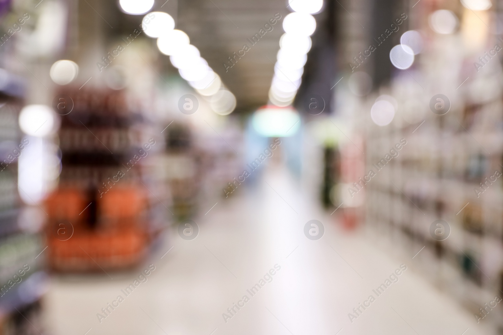 Photo of Blurred view of modern supermarket interior. Bokeh effect