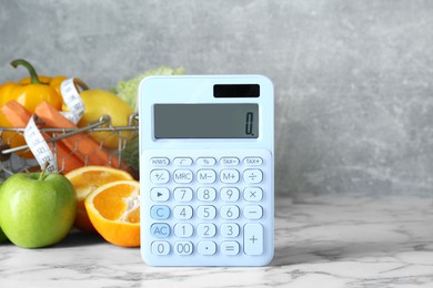 Photo of Calculator and food products on white marble table. Weight loss concept
