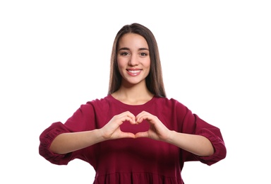 Photo of Woman showing HEART gesture in sign language on white background
