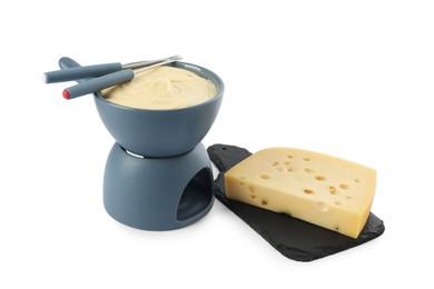 Photo of Fondue with tasty melted cheese, forks and piece isolated on white