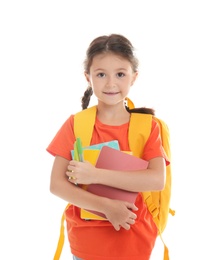 Photo of Cute child with school stationery on white background