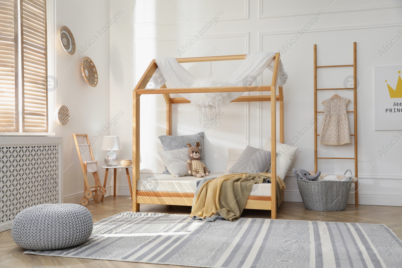 Photo of Stylish child room interior with house bed