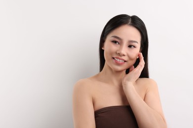 Portrait of beautiful woman on white background