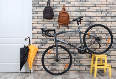 Photo of Modern bicycle in stylish hallway interior
