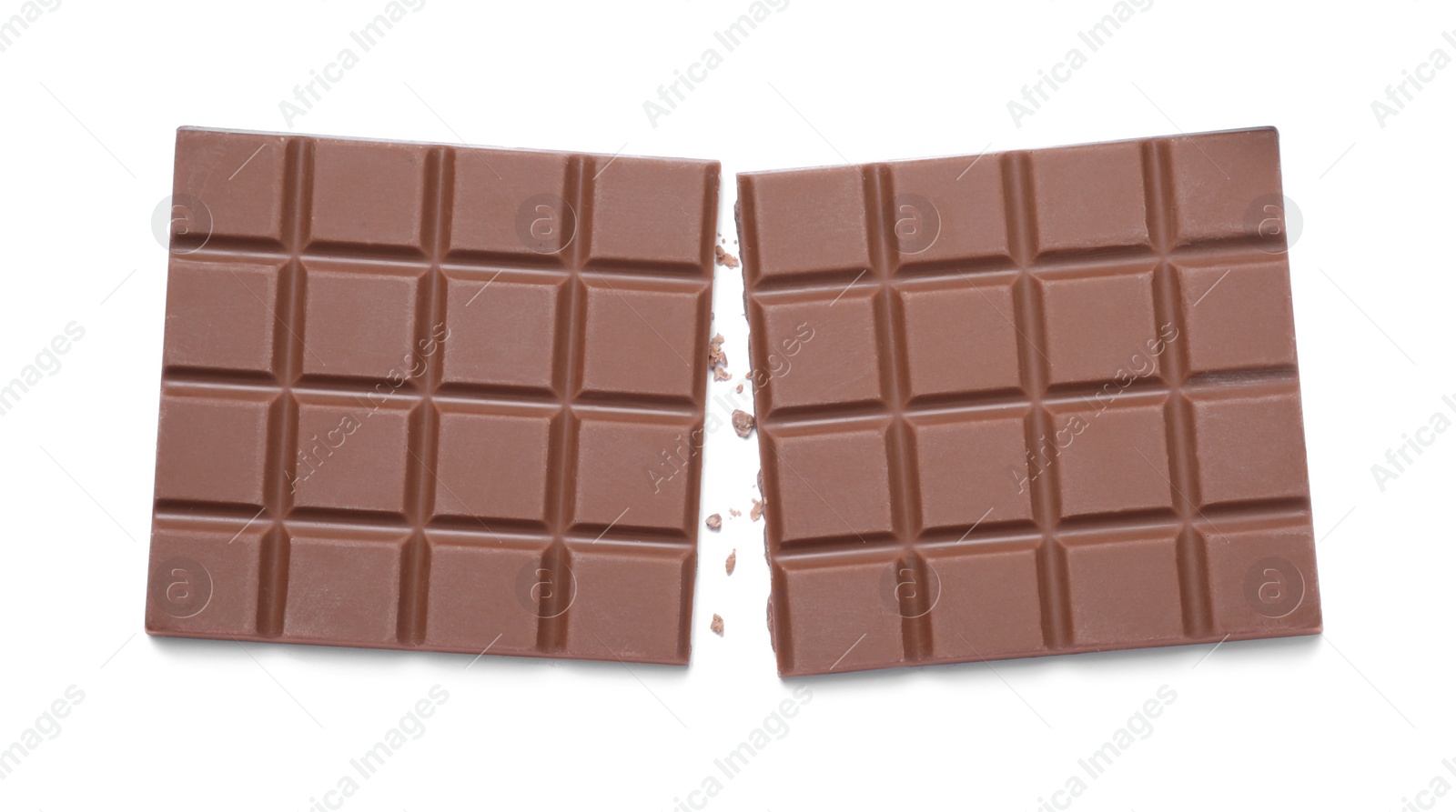 Photo of Pieces of tasty milk chocolate bar isolated on white, top view