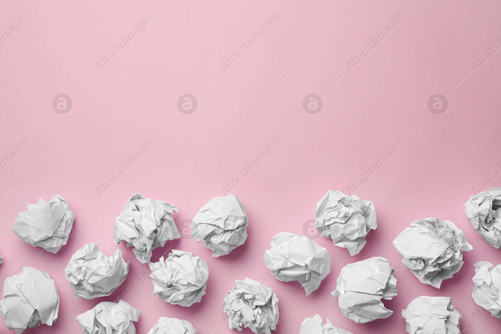 Photo of Paper balls on color background, flat lay. Space for text