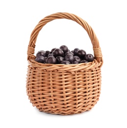 Photo of Wicker basket with fresh acai berries on white background