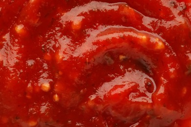 Texture of delicious adjika sauce as background, closeup