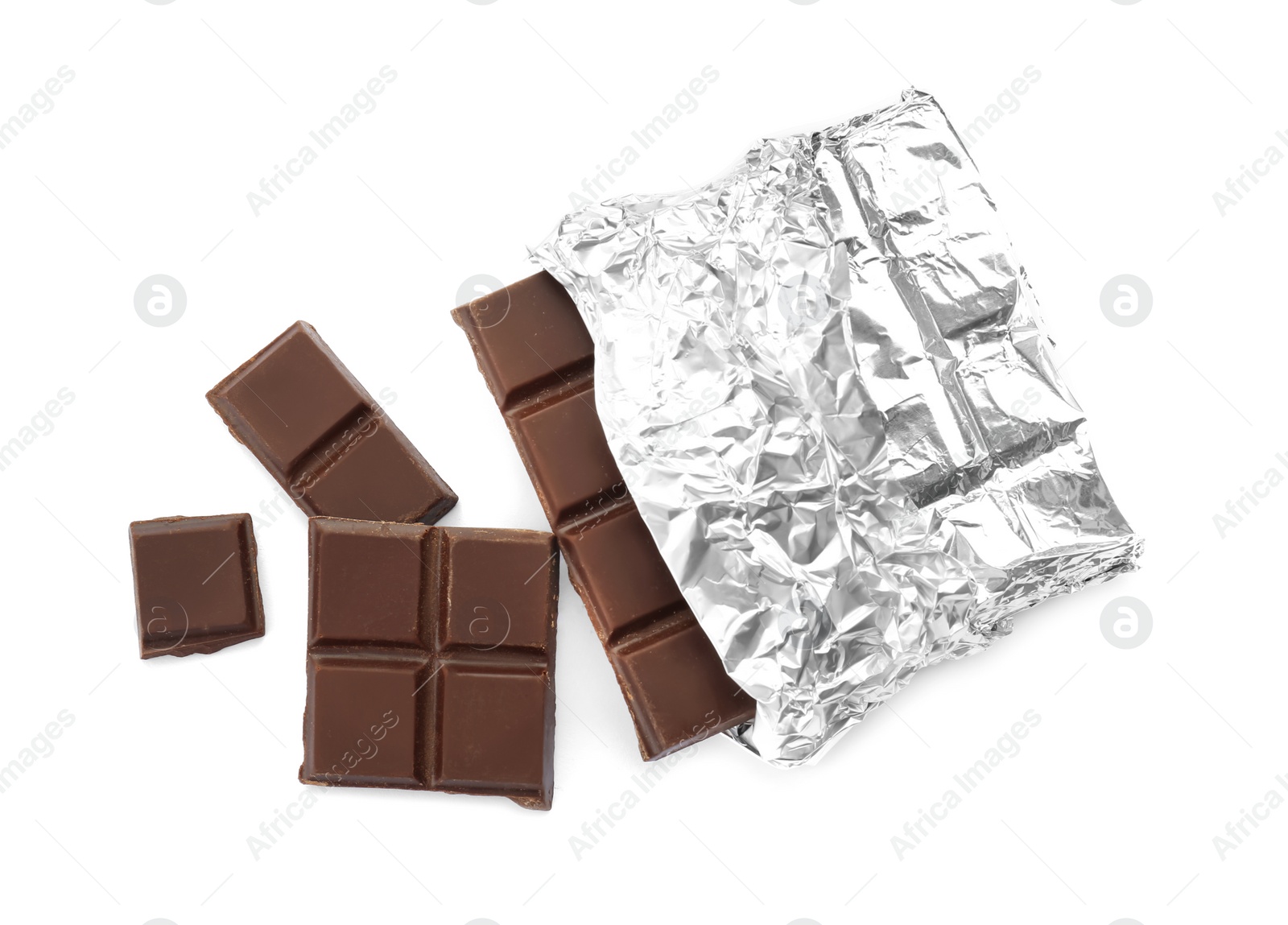 Photo of Delicious black chocolate bar in foil on white background, top view