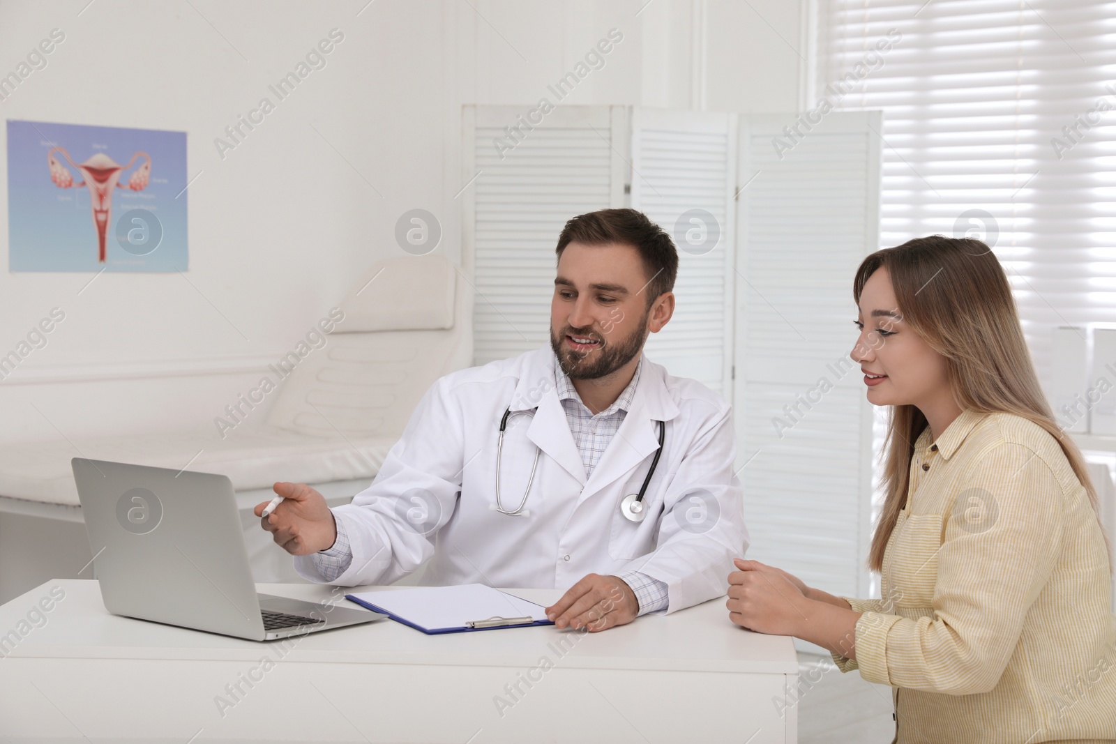 Photo of Young woman having appointment in gynecologist office