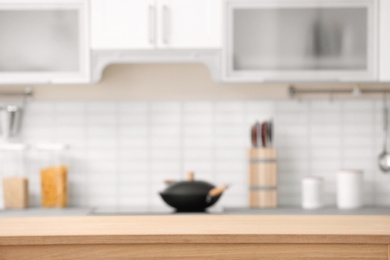 Photo of Countertop and blurred view of kitchen interior on background