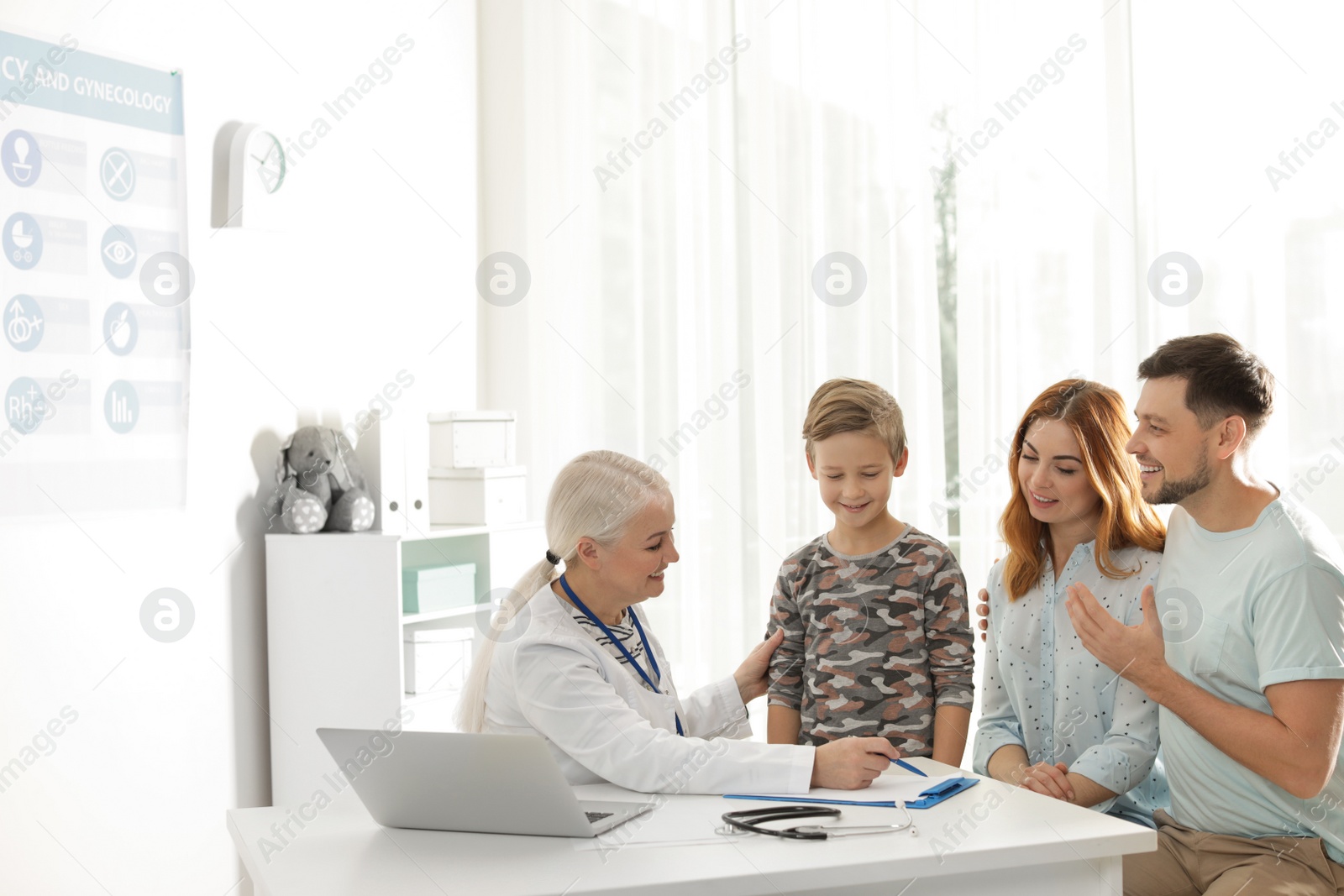 Photo of Family with child visiting doctor in hospital