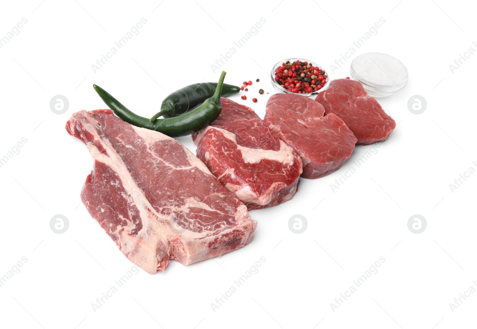 Photo of Cut fresh beef meat with spices isolated on white