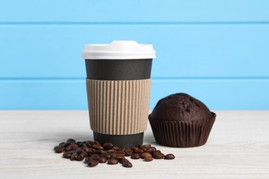 Photo of Paper cup with plastic lid, coffee beans and muffin on white wooden table. Coffee to go