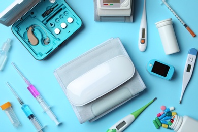 Photo of Flat lay composition with different medical objects on color background