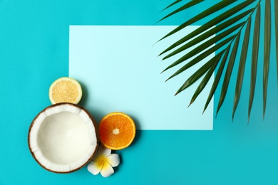 Photo of Flat lay composition with fresh coconut half on blue background. Space for text