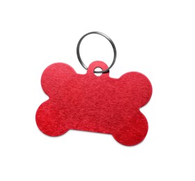 Photo of Red metal bone shaped dog tag with ring isolated on white