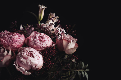 Photo of Beautiful bouquet of different flowers on black background, space for text. Floral card design with dark vintage effect