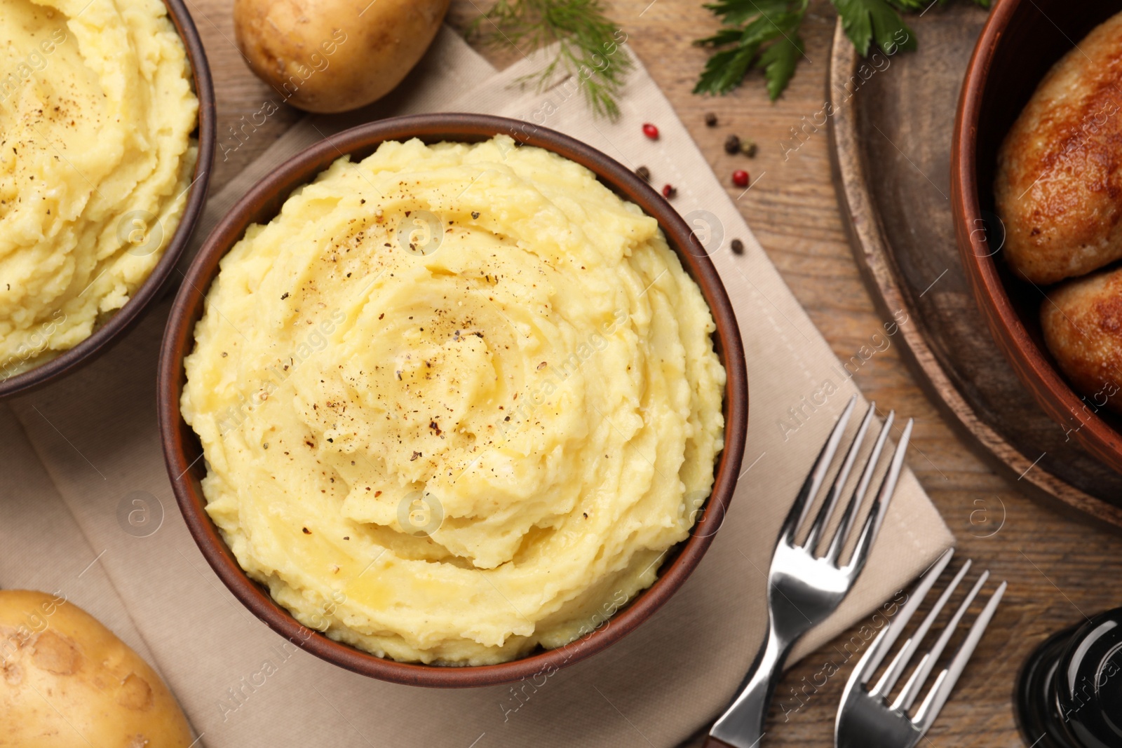 Photo of Flat lay composition with tasty mashed potatoes on wooden table