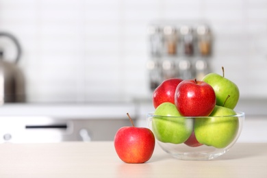 Bowl of fresh apples on kitchen counter. Space for text