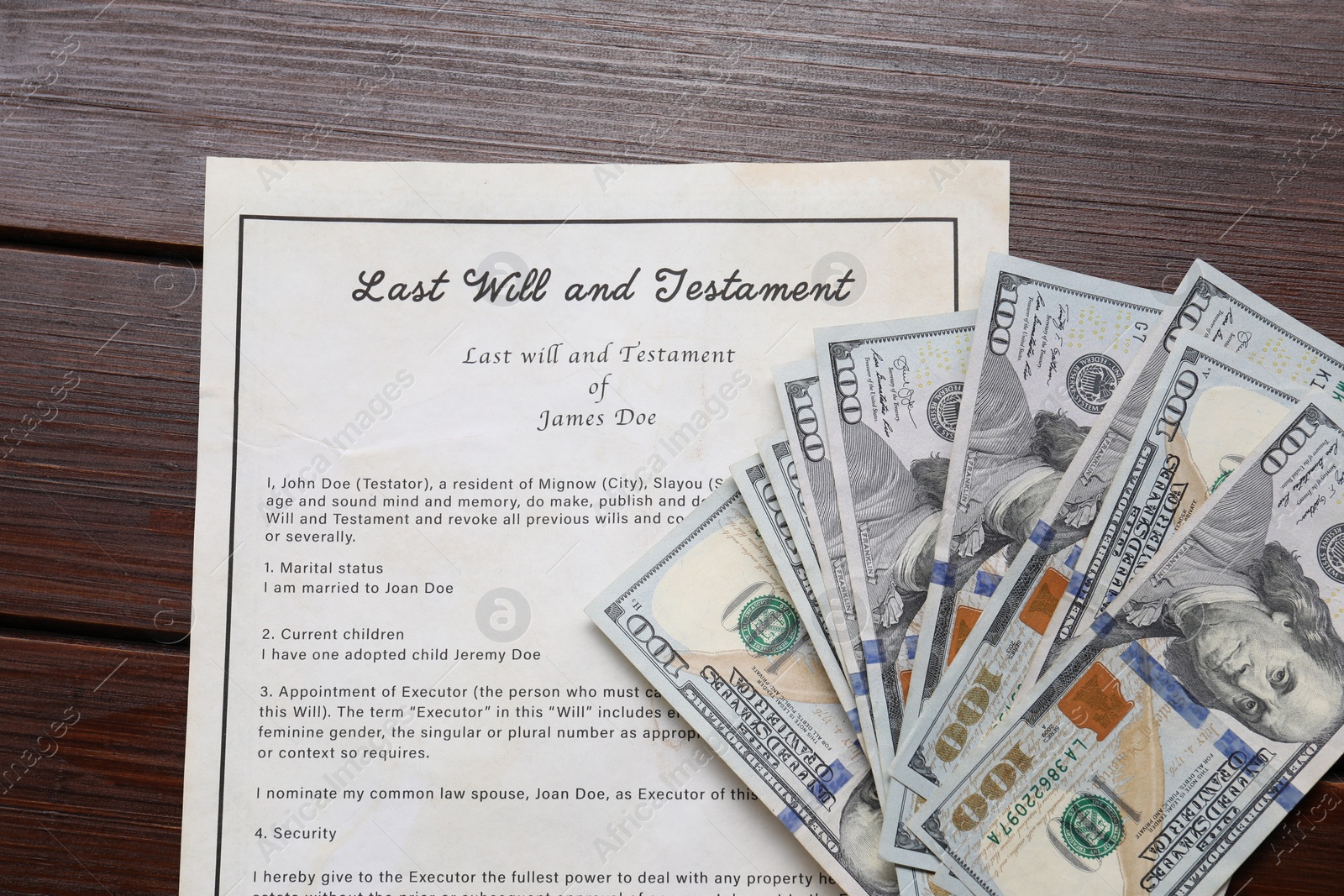 Photo of Last Will and Testament with dollar bills on wooden table, top view