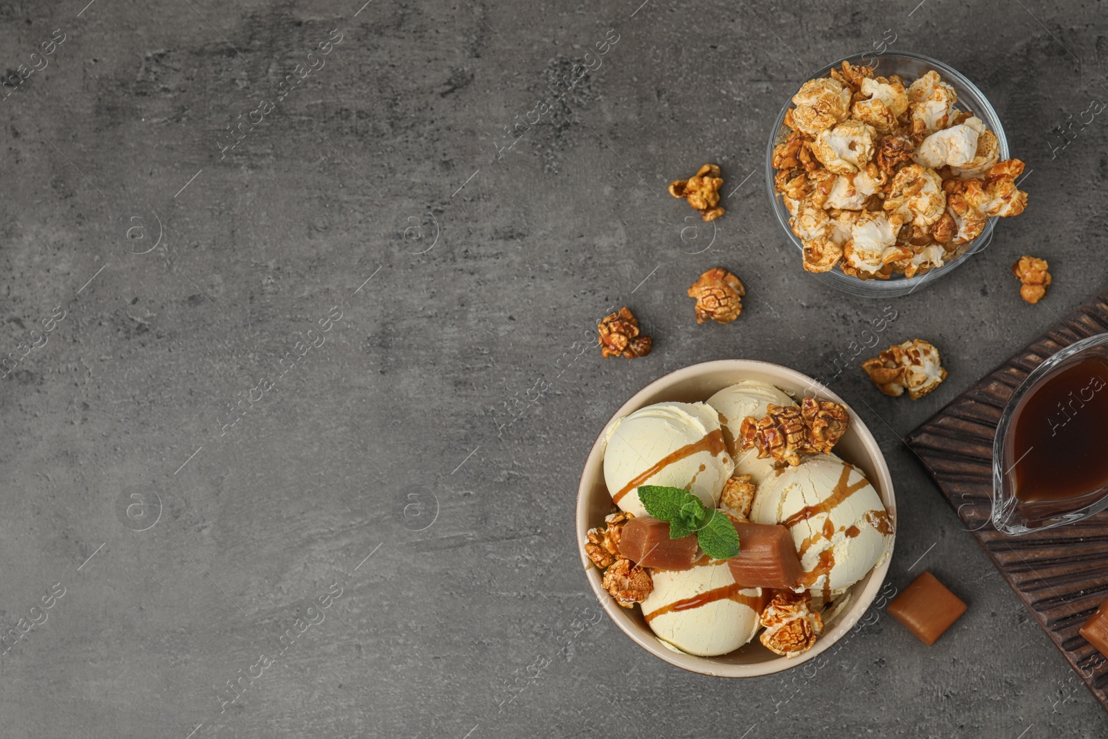 Photo of Flat lay composition with delicious ice cream on table. Space for text